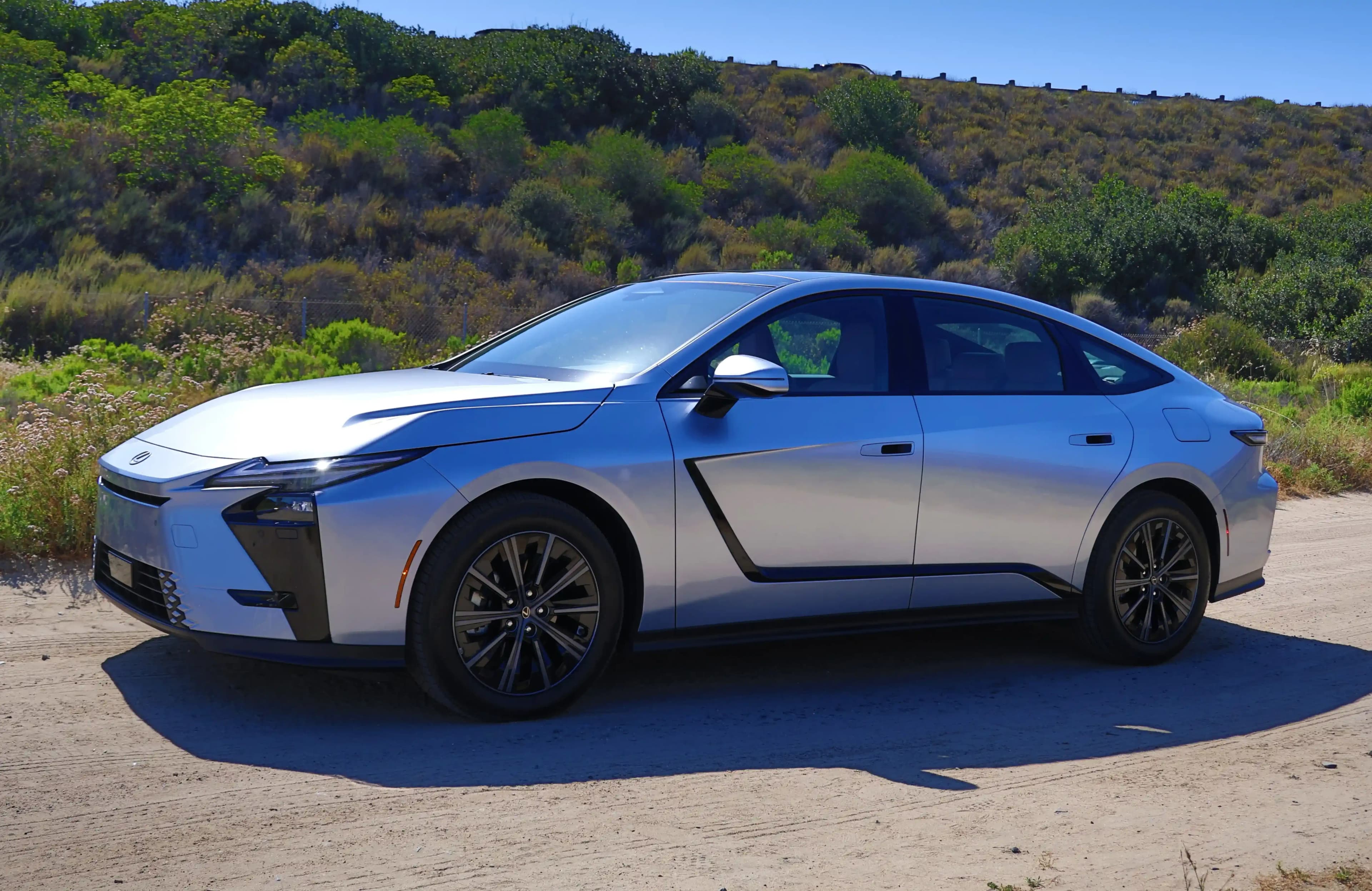 Front three-quarter view of a silver Lexus ES sedan parked outdoors.