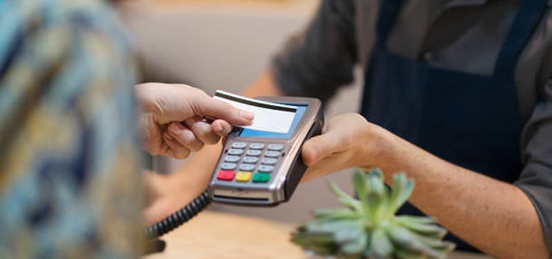 Person tapping credit car for payment