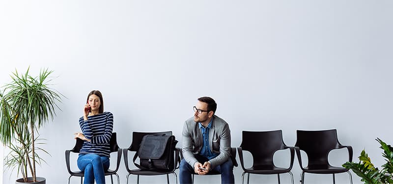 Woman and man in waiting room