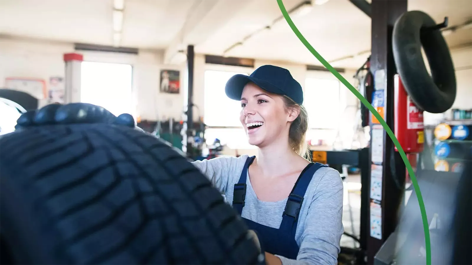 woman smiling installing tire