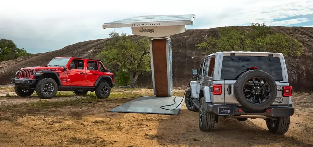 Two Jeep Wrangler 4xes at Jeep Charging Stations
