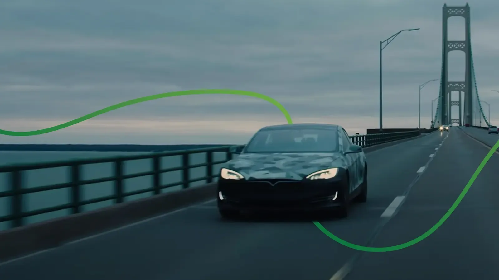 ev driving over bridge