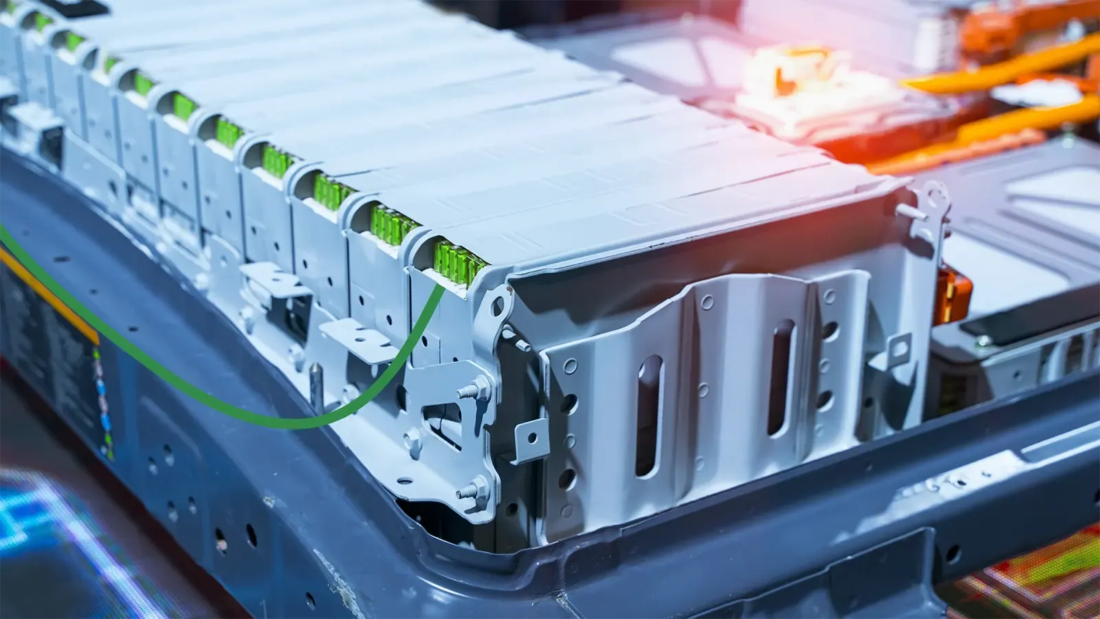 Battery with glowing orange light and green details