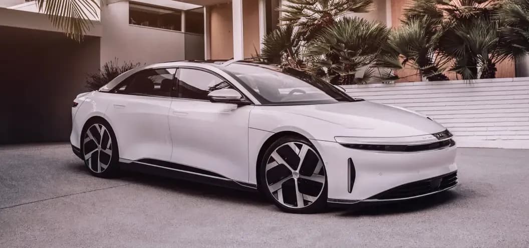 A white Lucid Air sedan side front profile