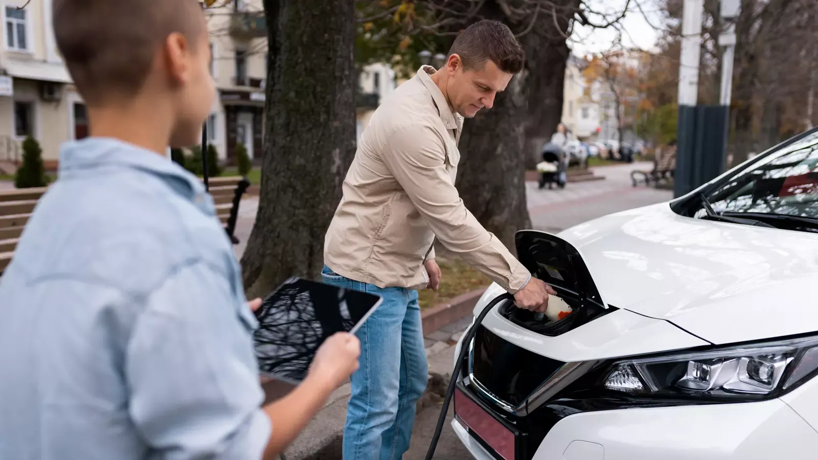 Father and son charging car