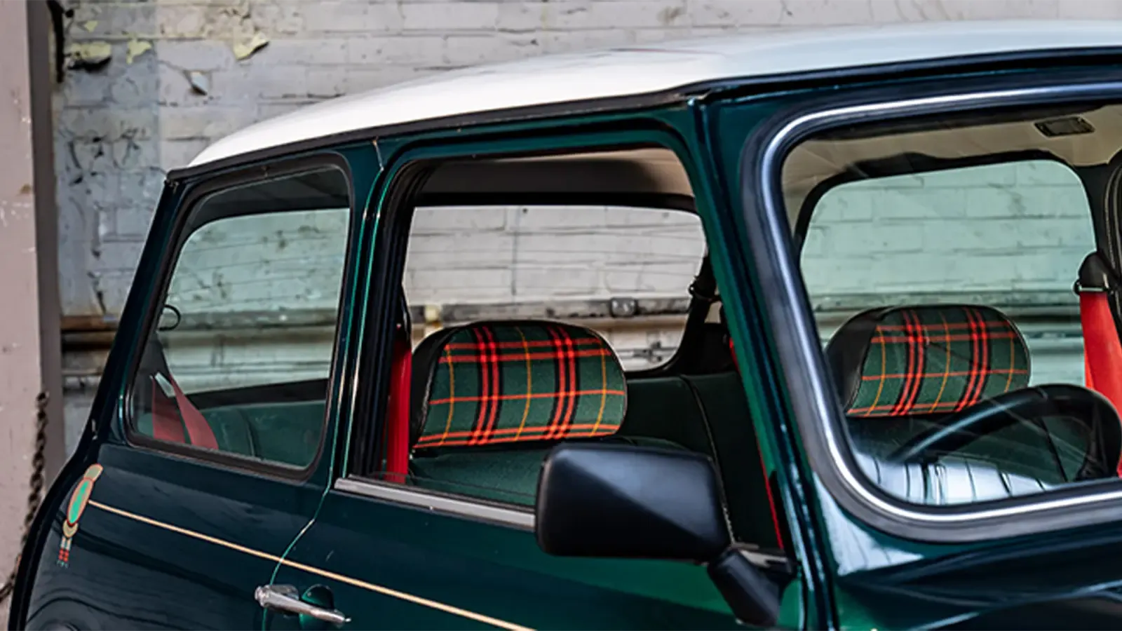 Interior shot of a green MINI with plaid upholstery