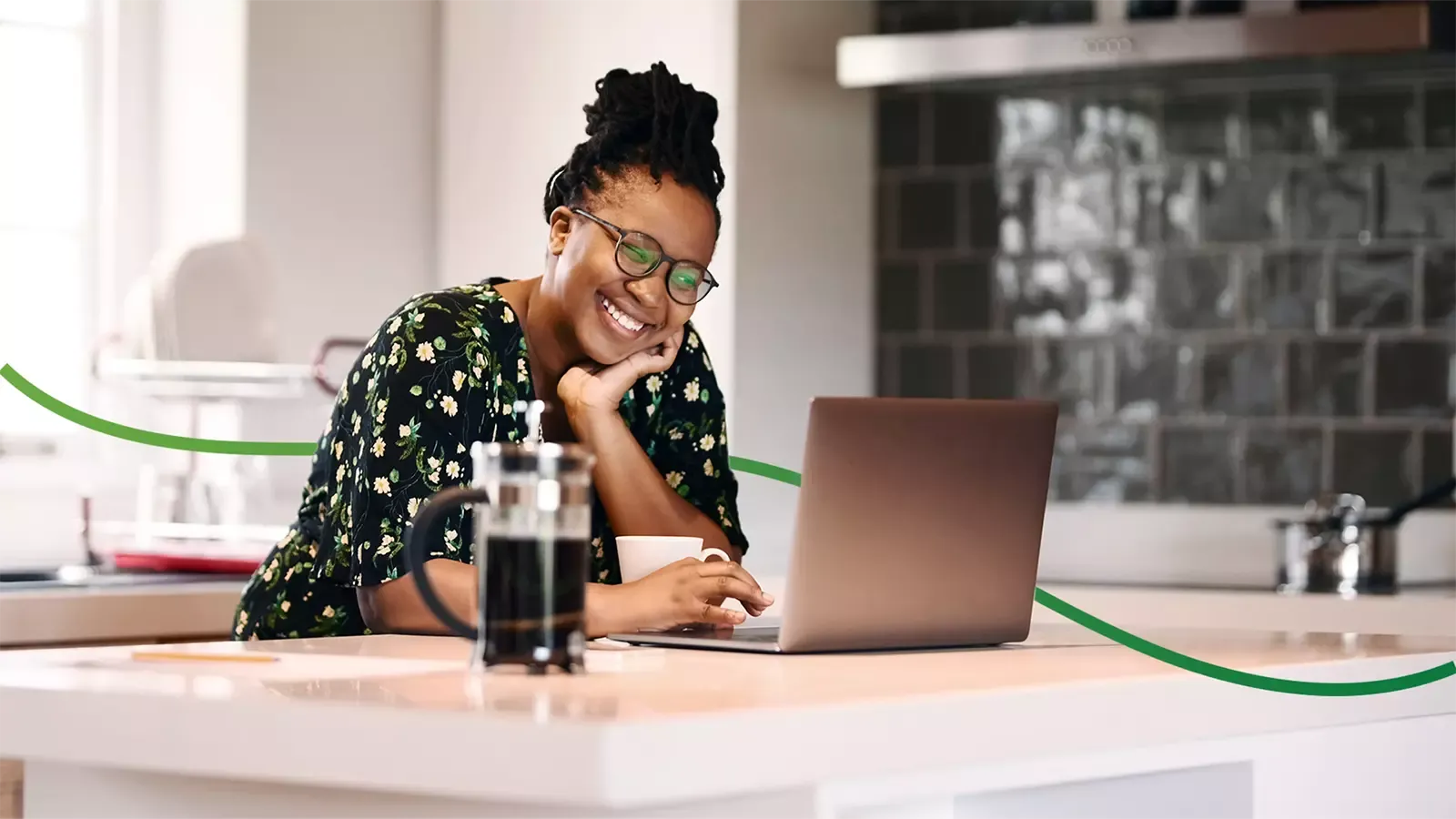 Woman smiling while shopping for an electric car on her laptop