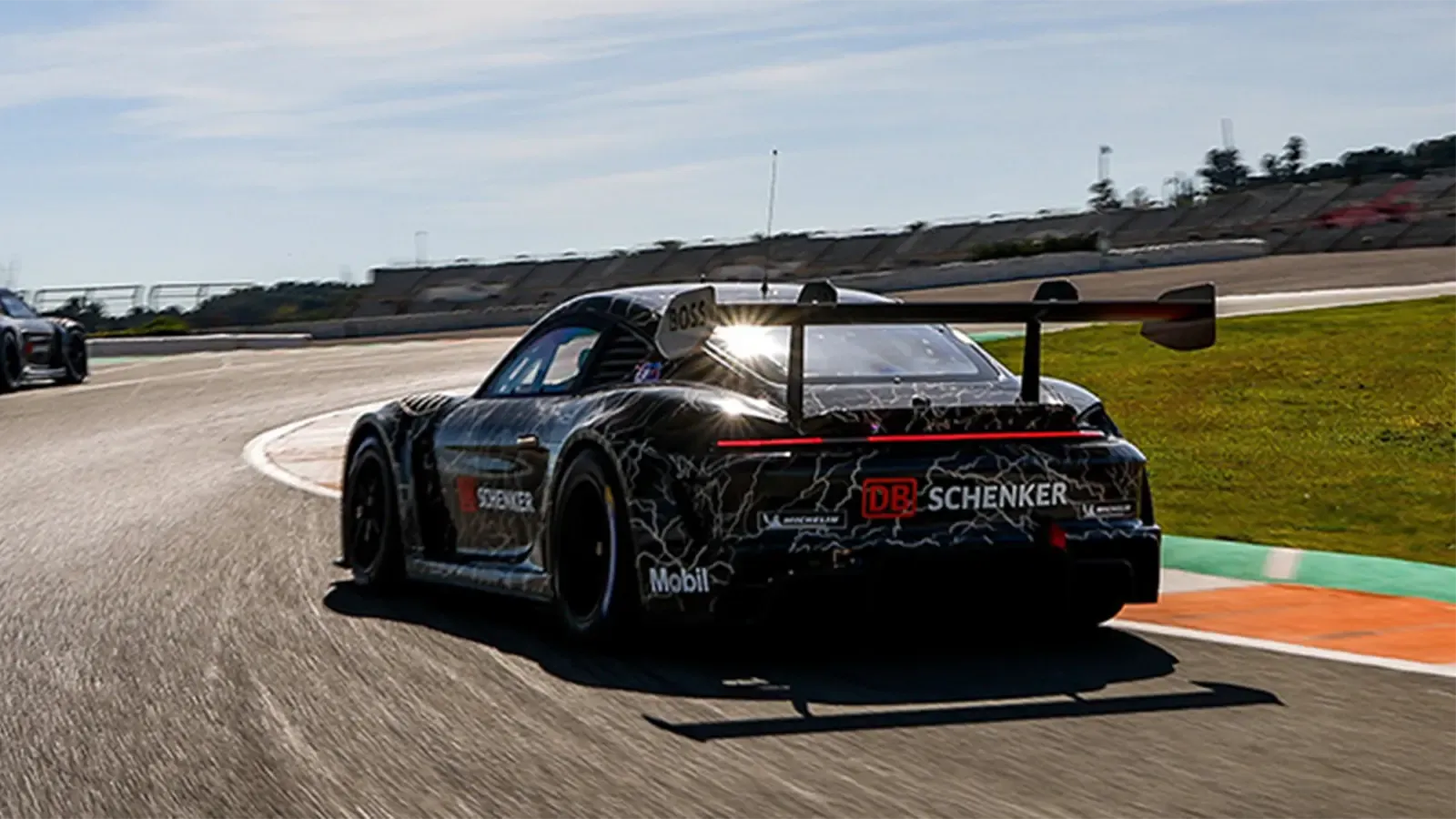 Rear view of Porsche race car on race track
