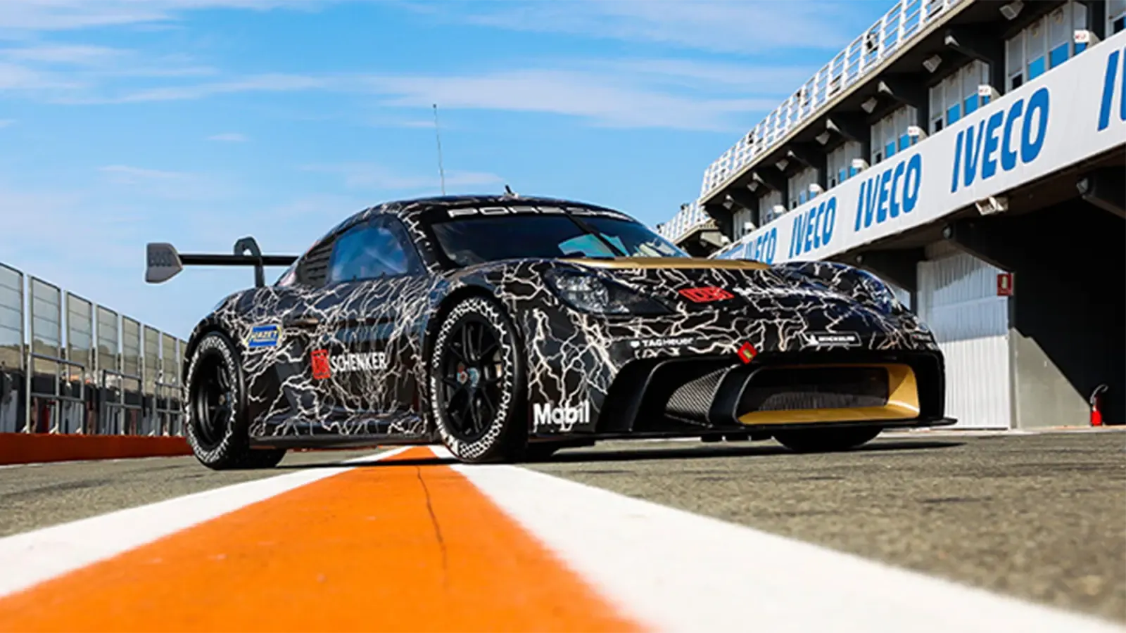 Porsche race car hero pose on race track