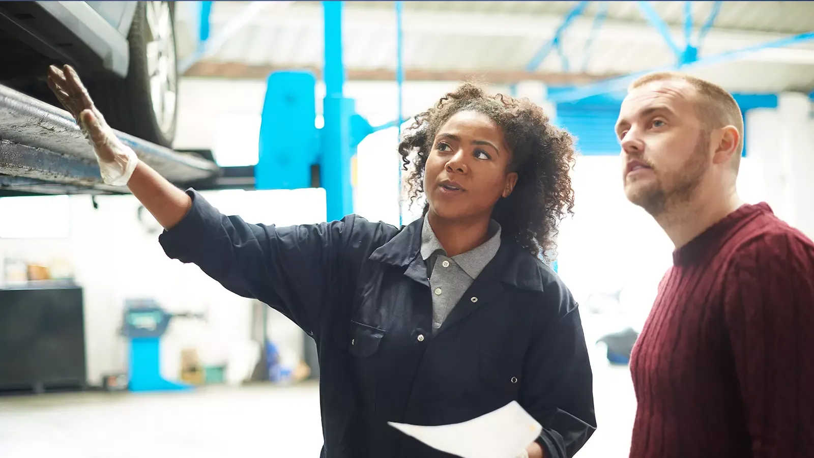 mechanic explaining service to customer