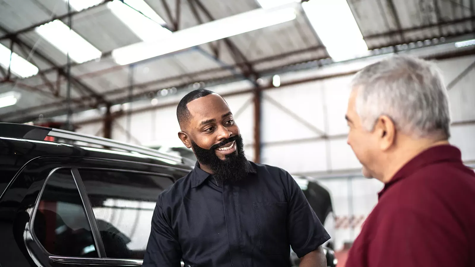 Customer speaking to a service rep about his EV