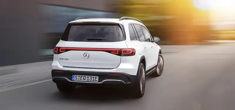 White 2023 Mercedes-Benz EQB Rear Driving Photo