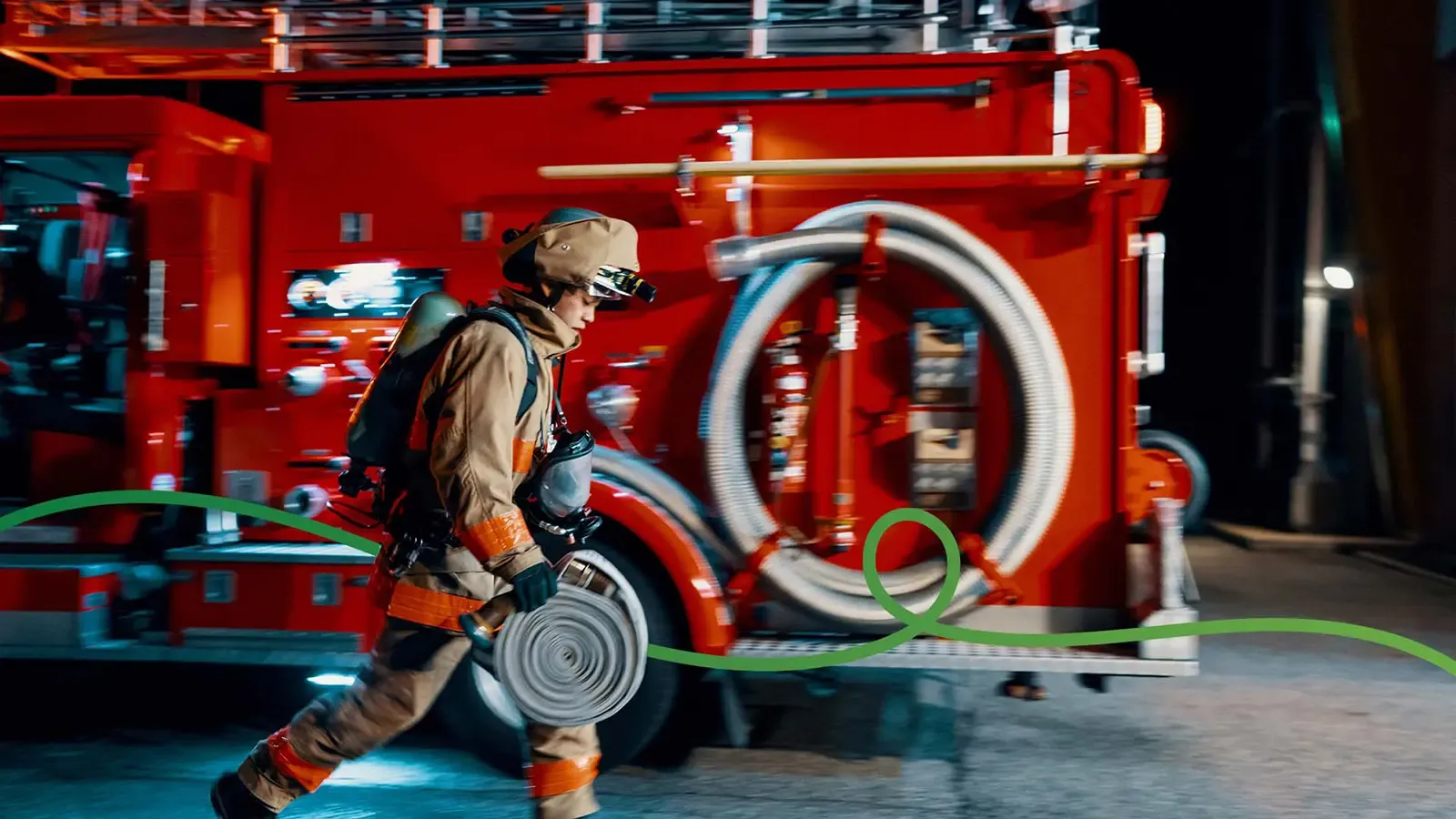Firefighter in front of a red fire truck