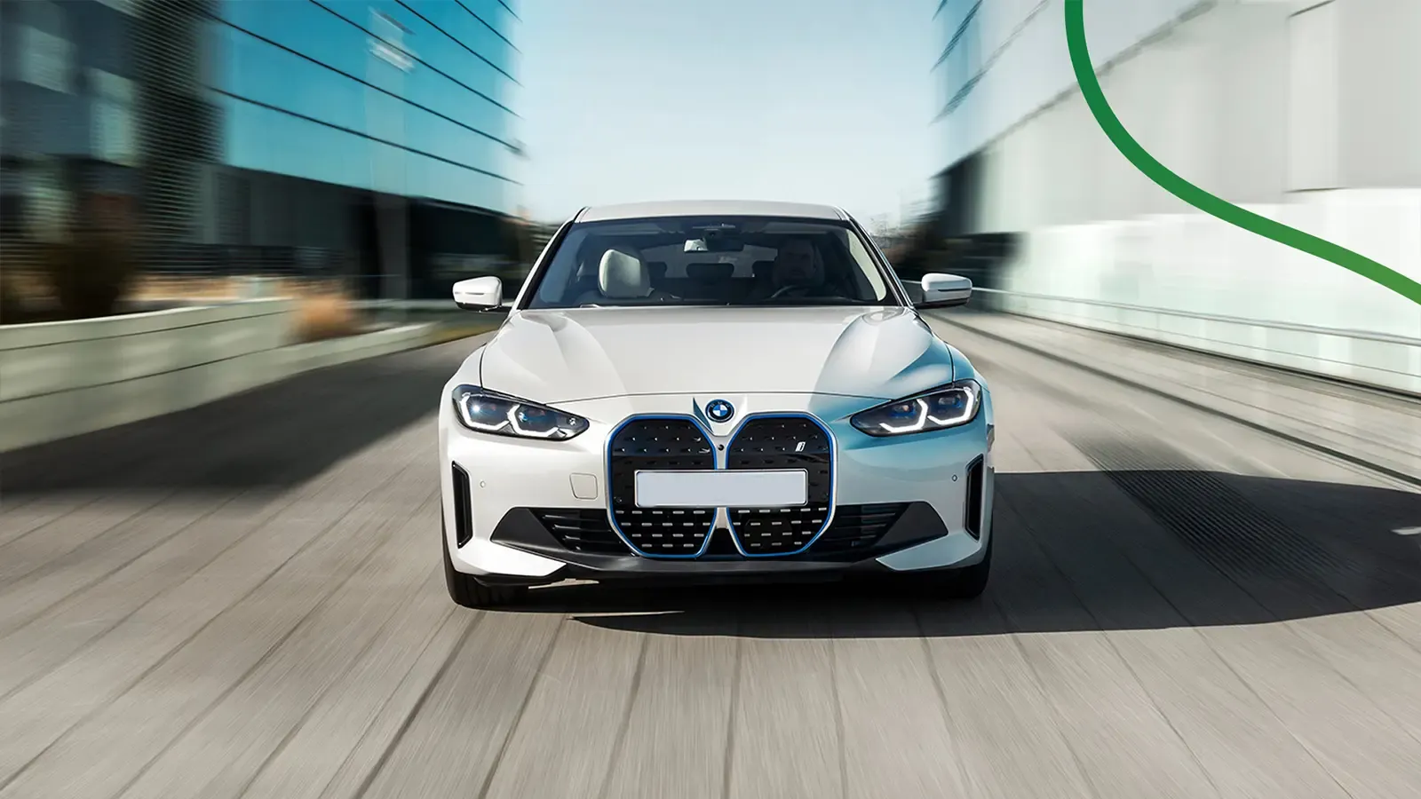 bmw i4 eDrive35 driving on paved city road