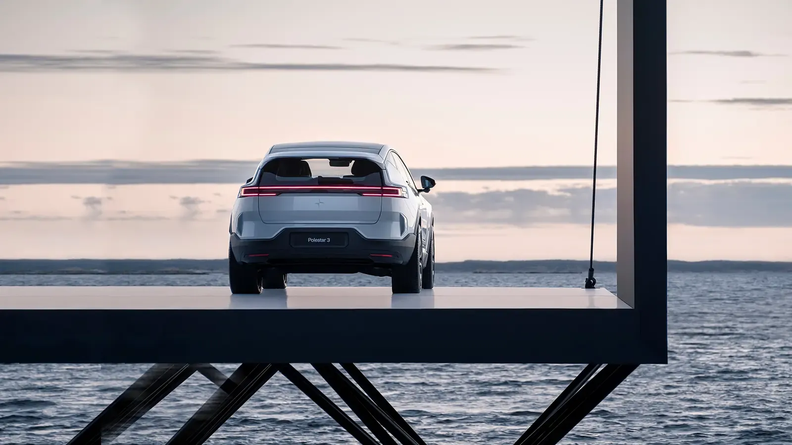polestar 3 suv parked on metal platform overlooking the ocean