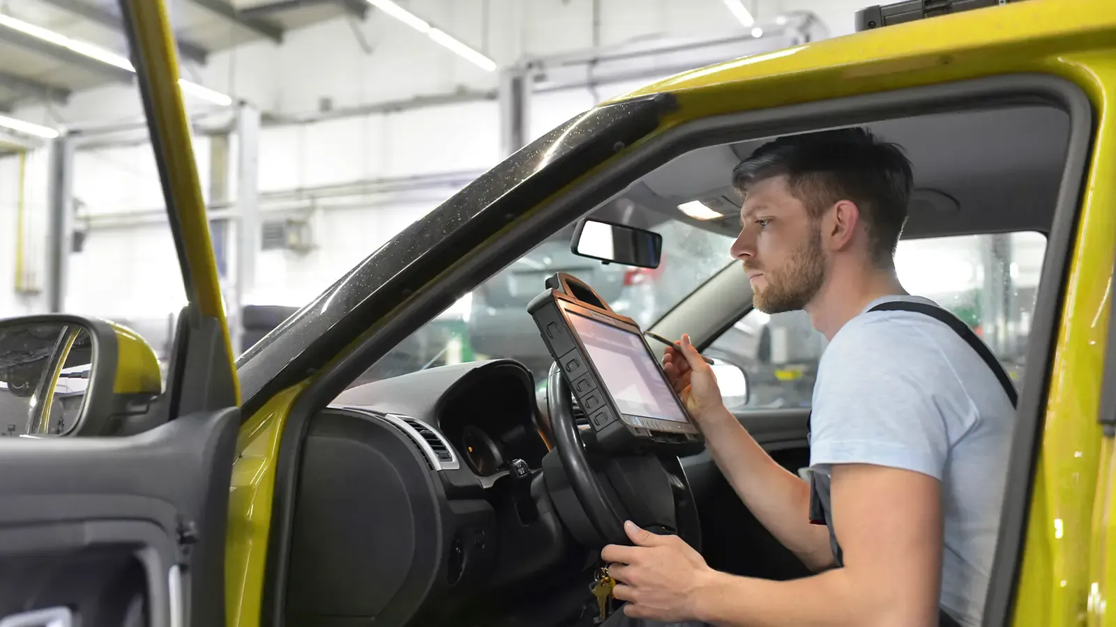Technician updating car computer