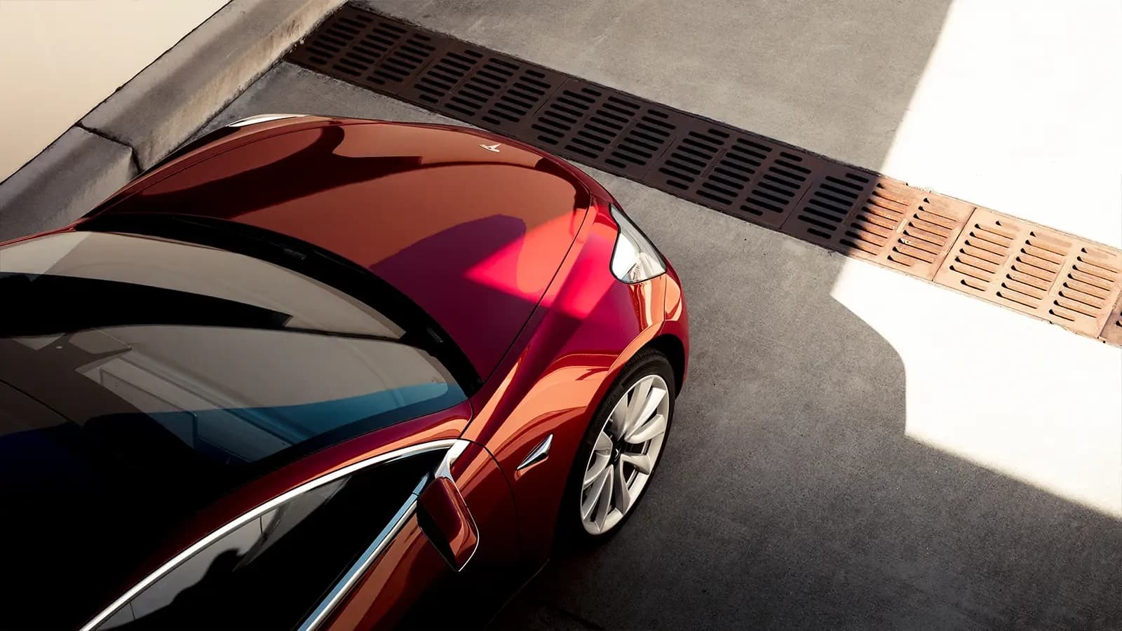 Tesla Model 3 top view in allyway