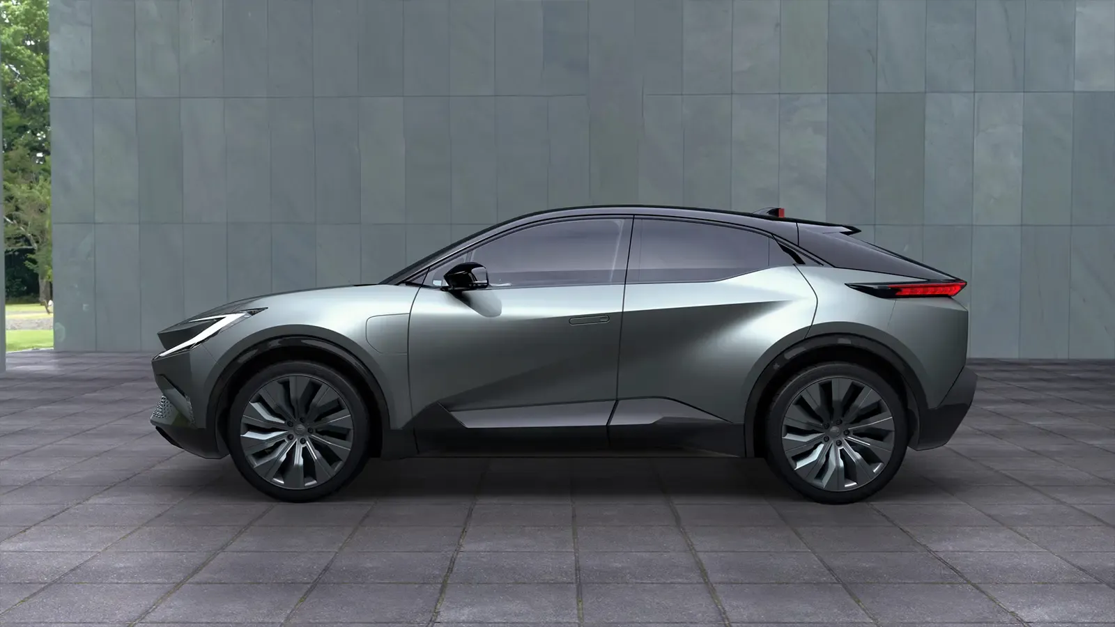 toyota bz compact prototype parked up against a gray wall