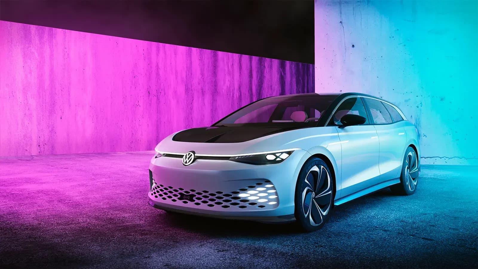 2024 ID.7 sedan parked in front of a vibrant pink and blue background
