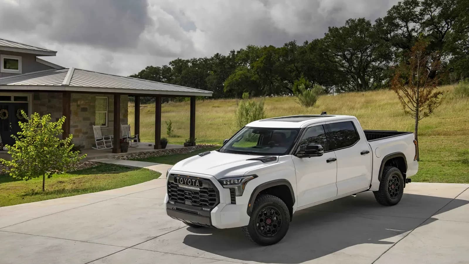 Toyota Tundra Hybrid parked in front of home