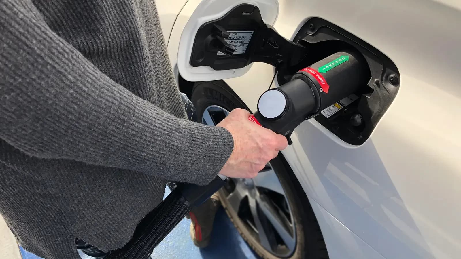 Person Charging Their Hydrogen Vehicle