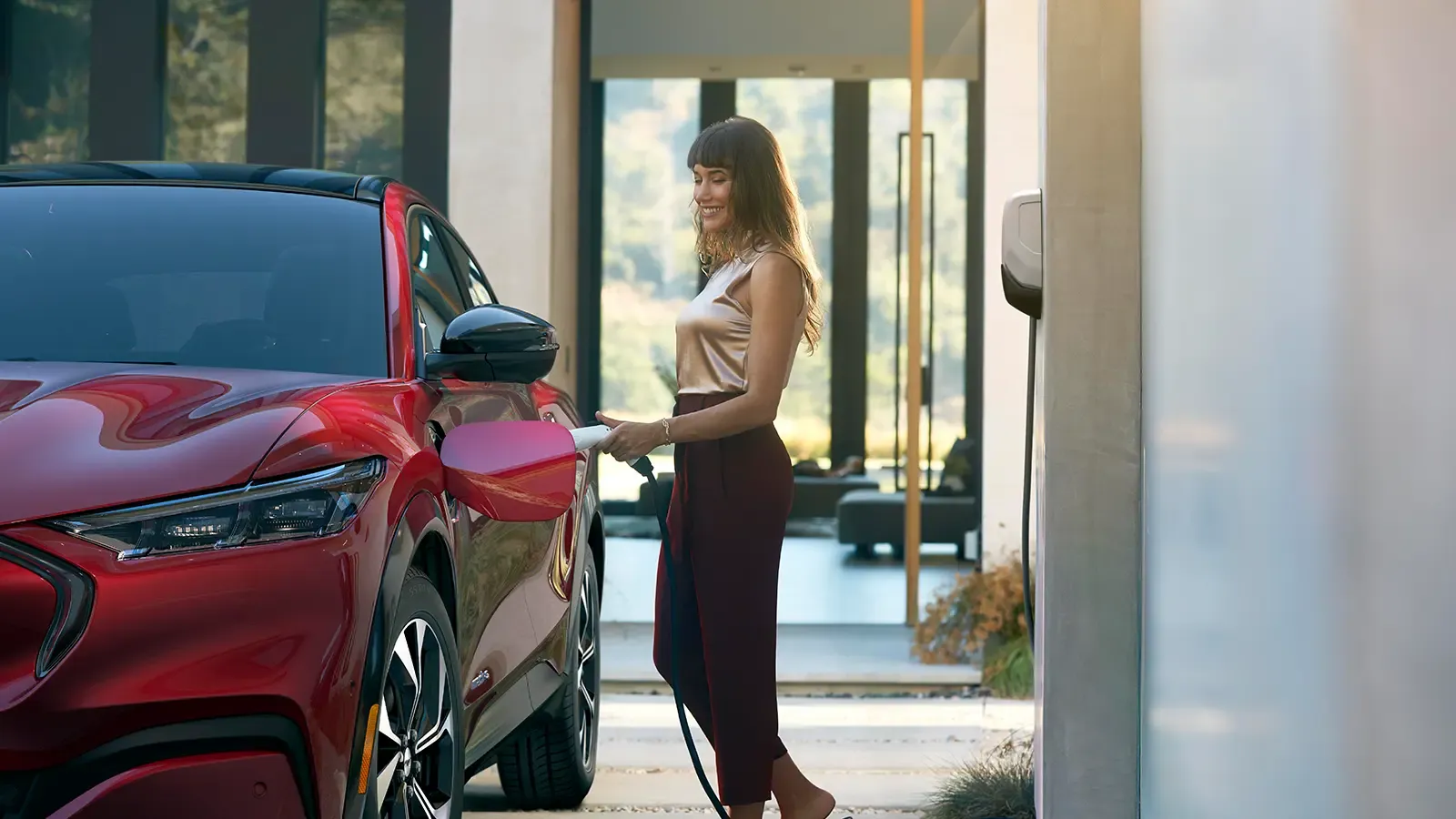 Woman chargings her Ford Mustang Mach-E
