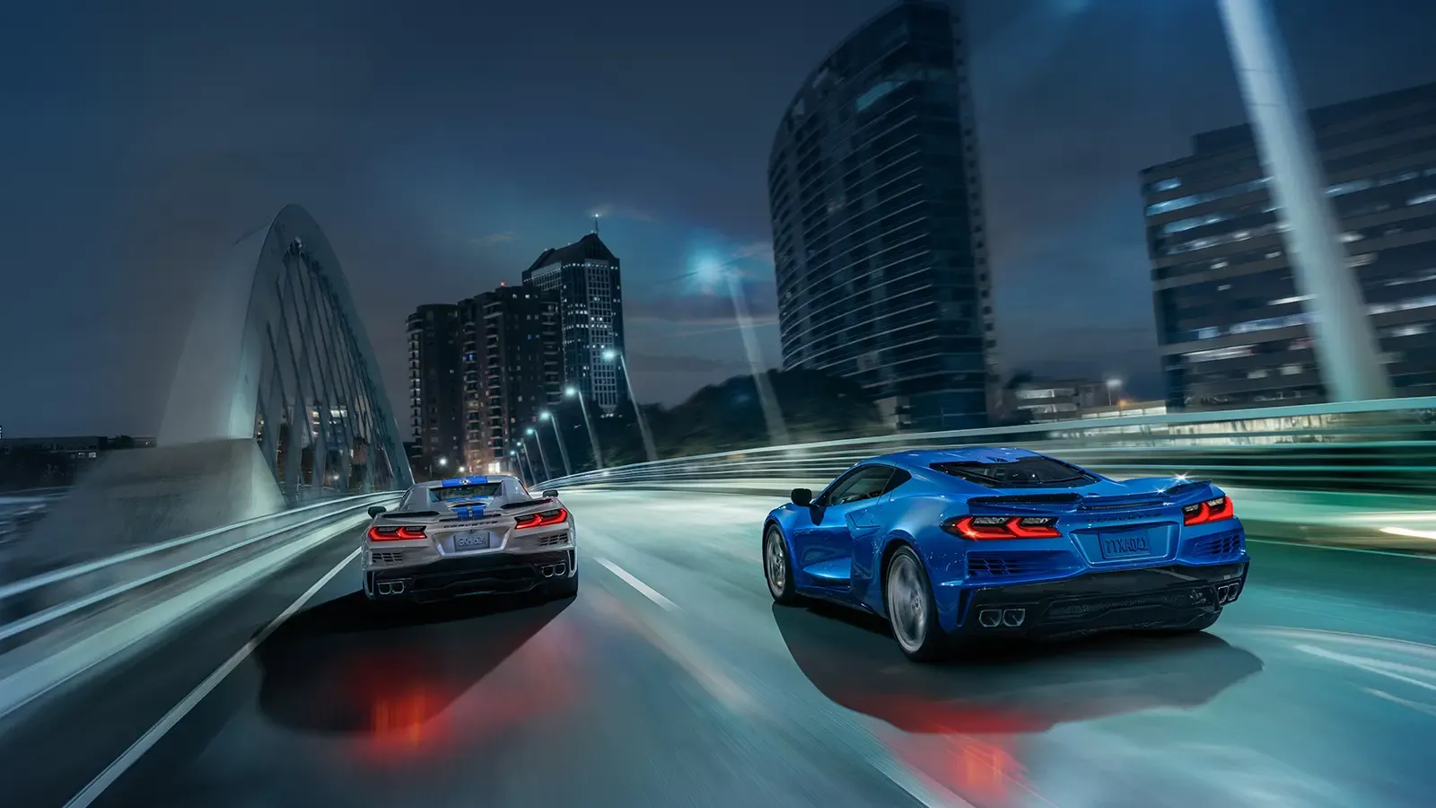 Two Corvettes racing in city