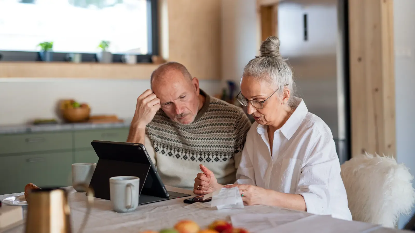 Elderly couple looking at finances