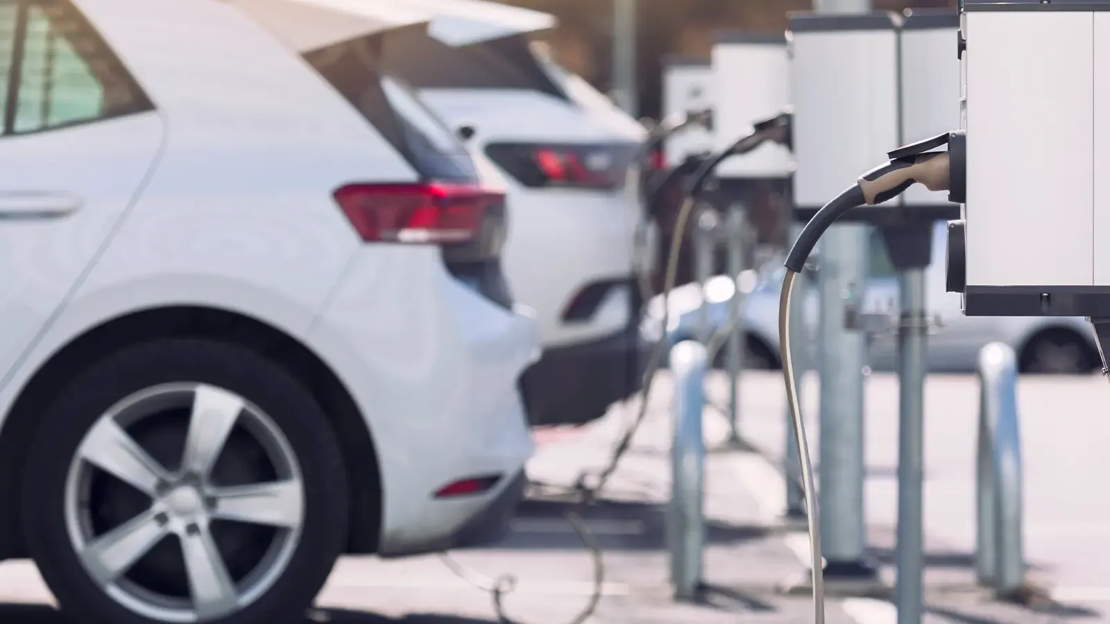 Cars lined up charging at a public charging station