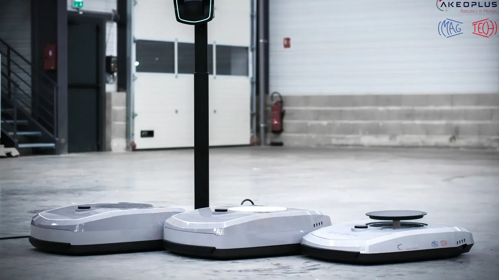 Car charging robots lined up in a garage