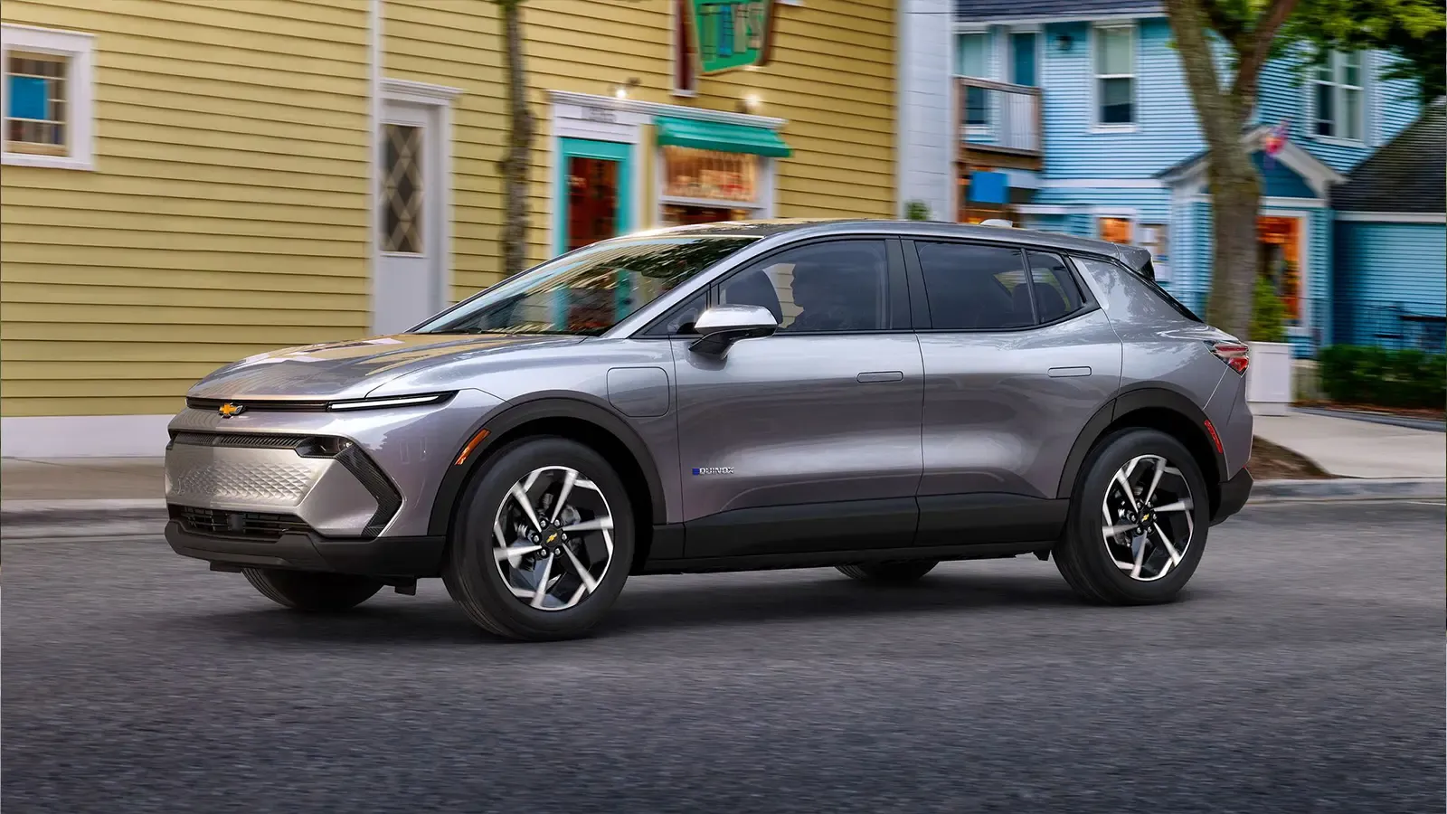 Chevrolet Equinox driving on the road, side profile