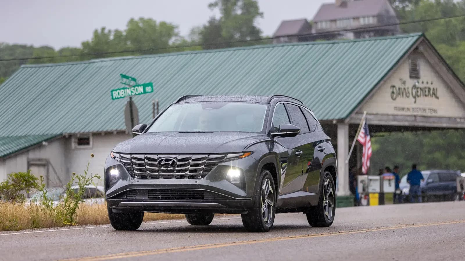 2 people driving Hyundai Tucson