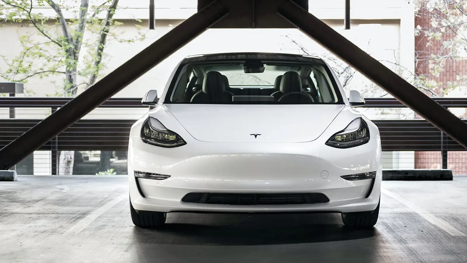white tesla electric car front exterior