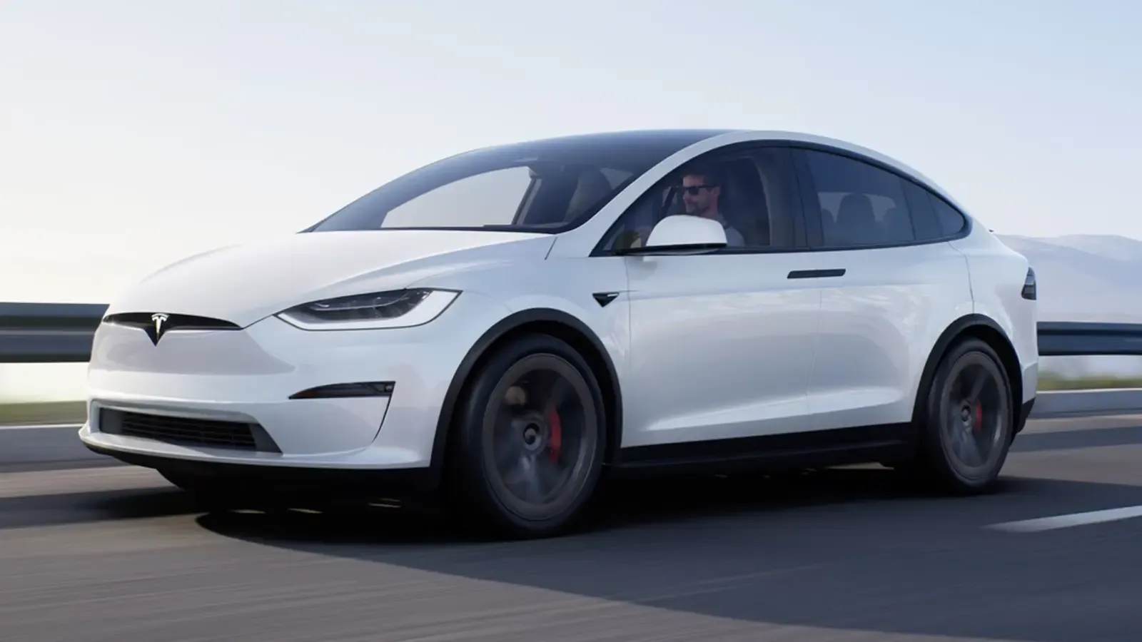 White Tesla Model X on the road
