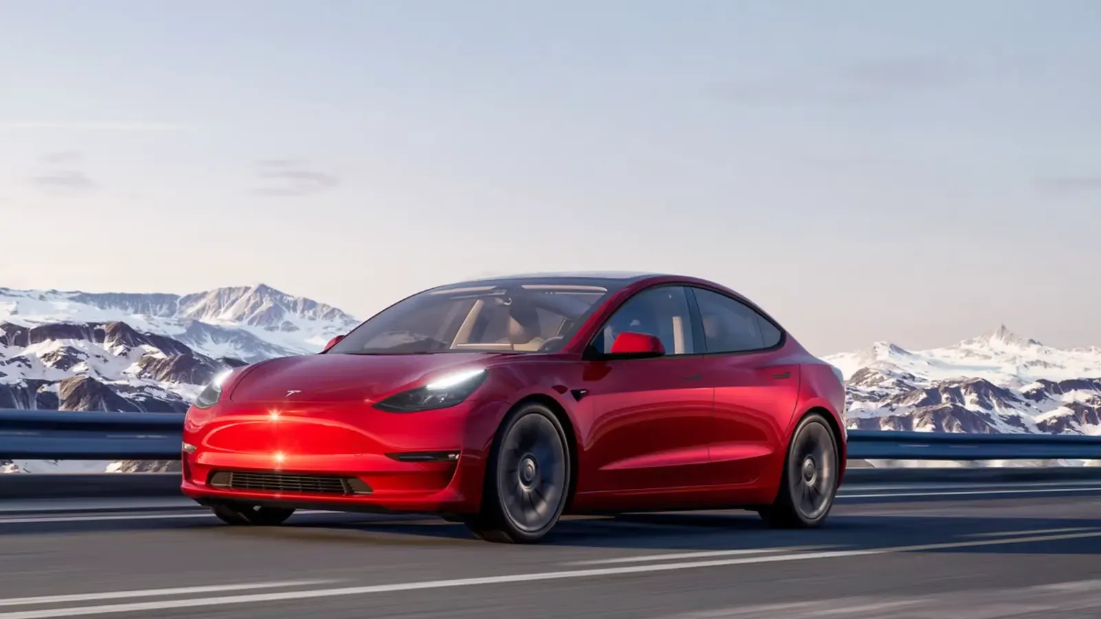 Red Tesla Model 3 on the road
