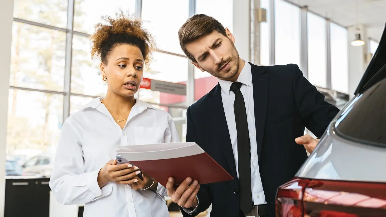Woman hesitant at car dealership