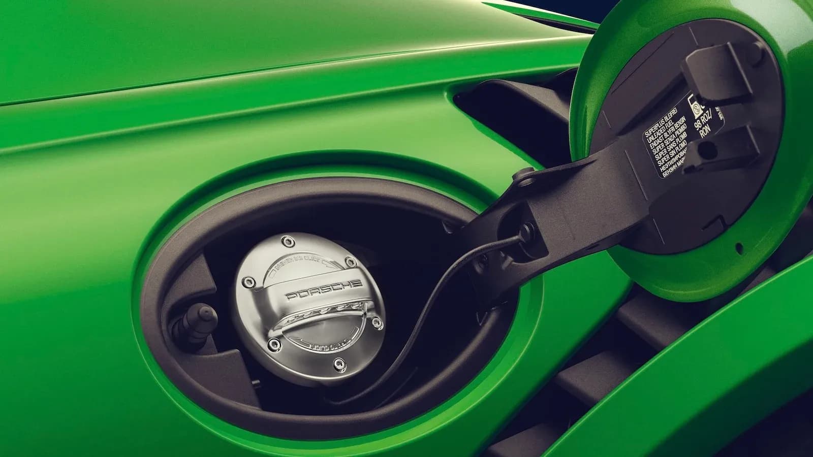 Porsche with fuel door open displaying the e-fuel cap
