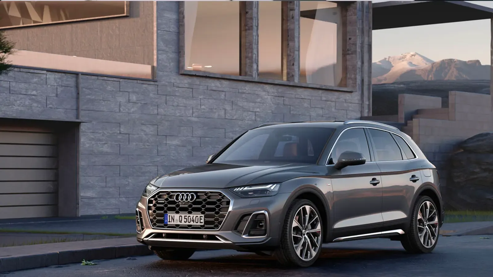 Audi Q5 TFSIe front exterior view by garage