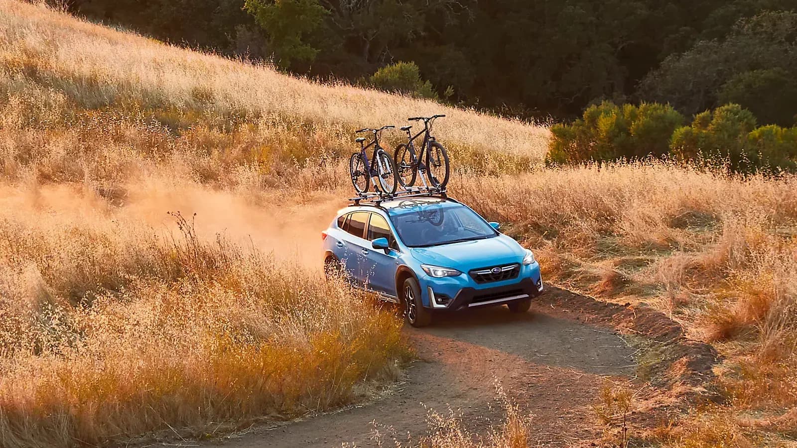 Subaru Crosstrek PHEV driving through path with bikes attached to hood