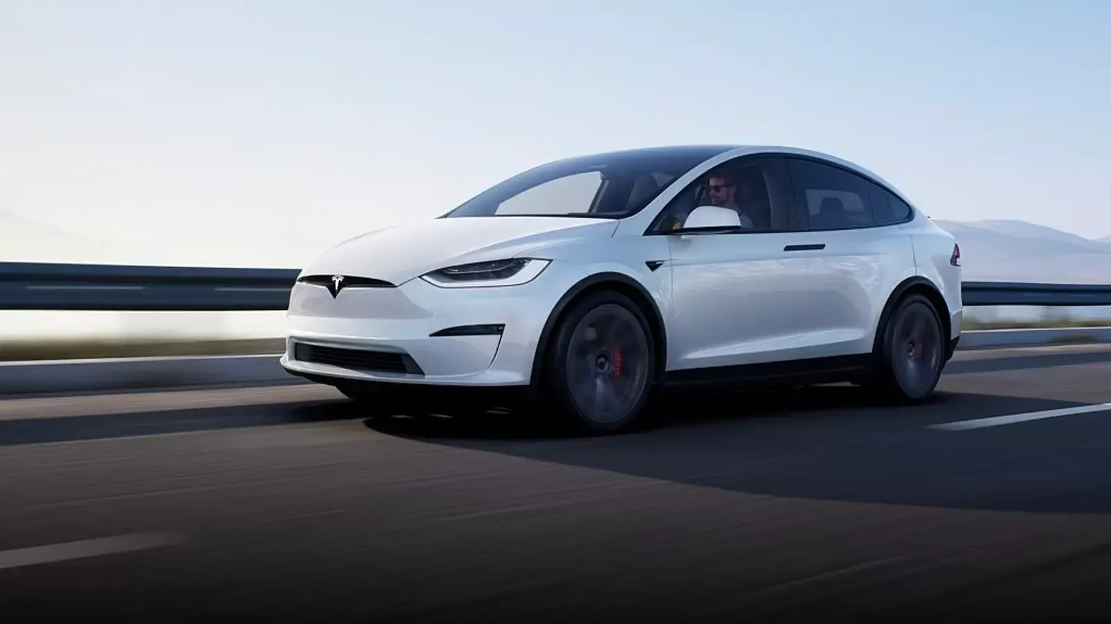Tesla Model X Long Range in white driving on the road