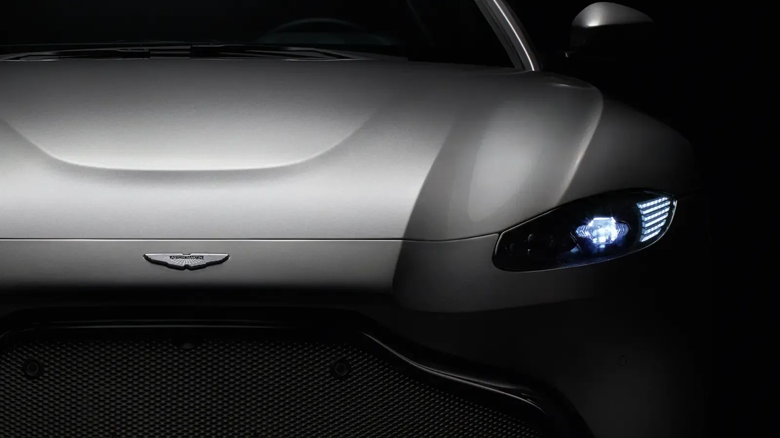 an Aston Martin mostly shrouded in shadows