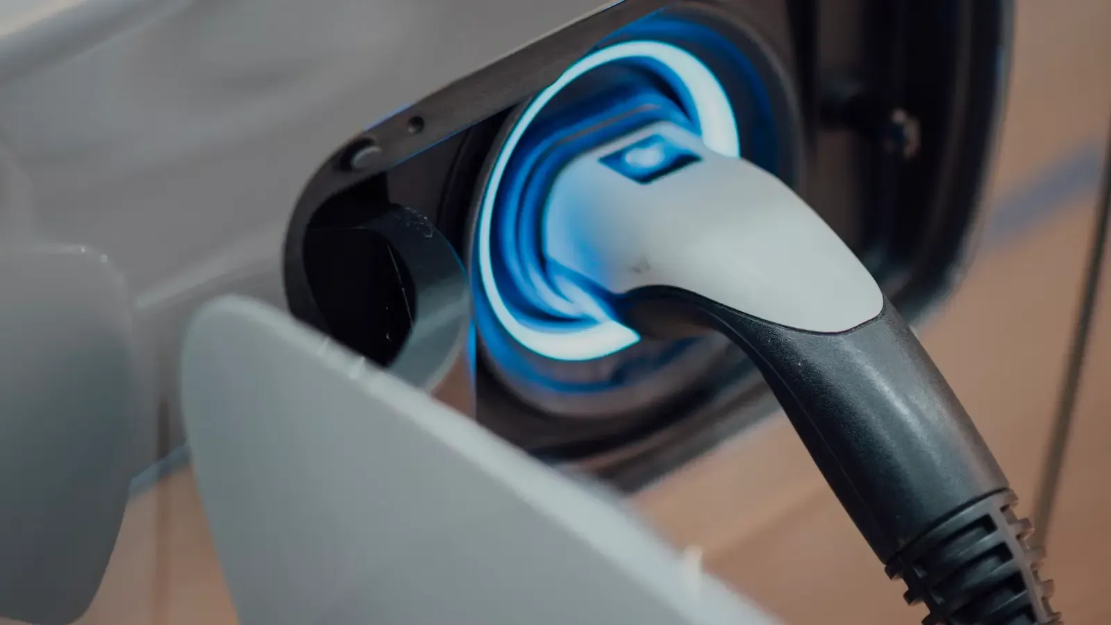 Zoom in of a car charging port being used