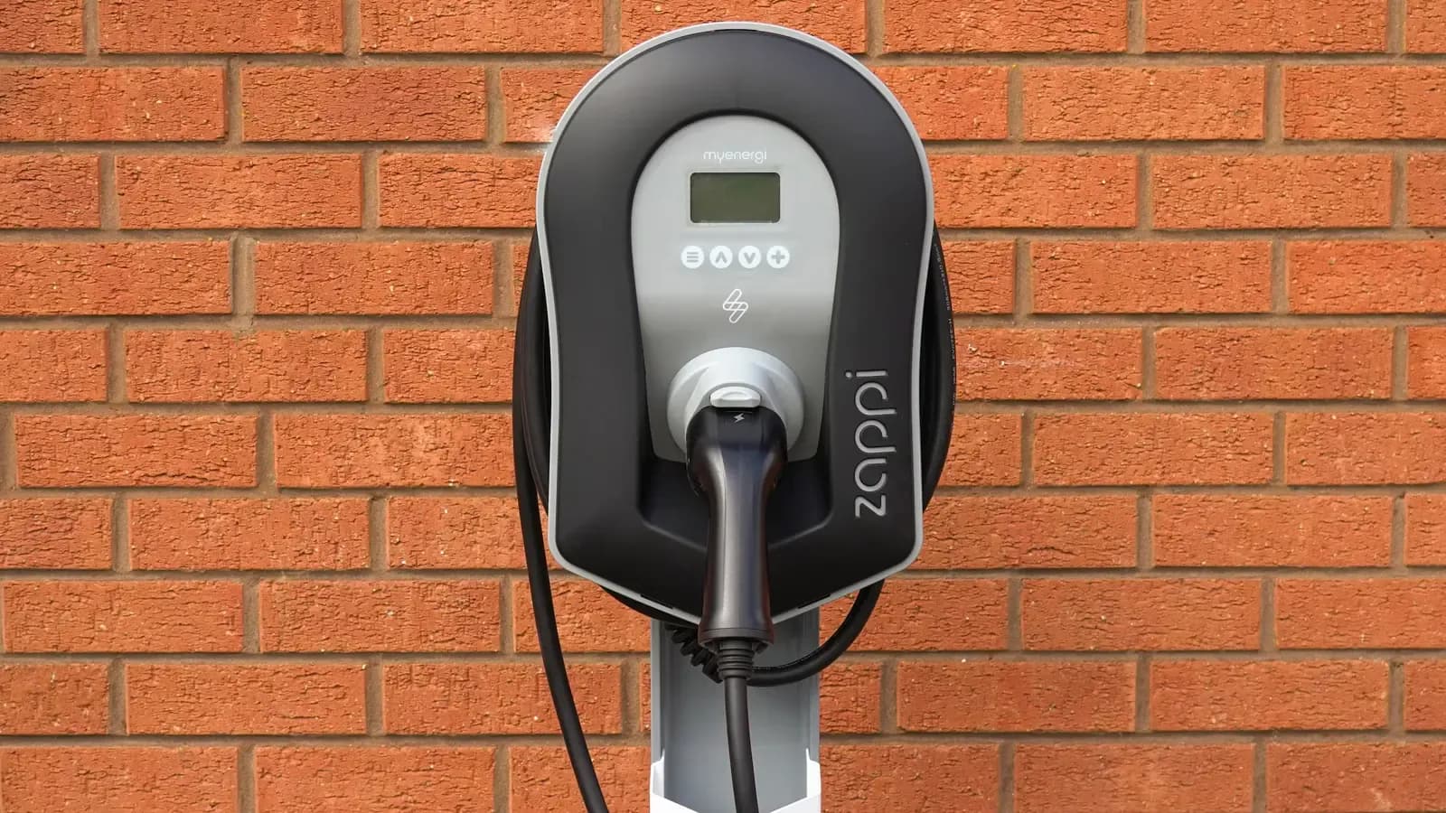 Public charger against a brick wall