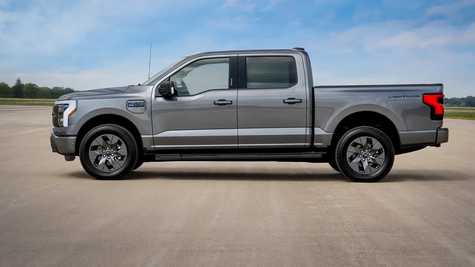 side profile of the Ford F-150 Lightning exterior on a road