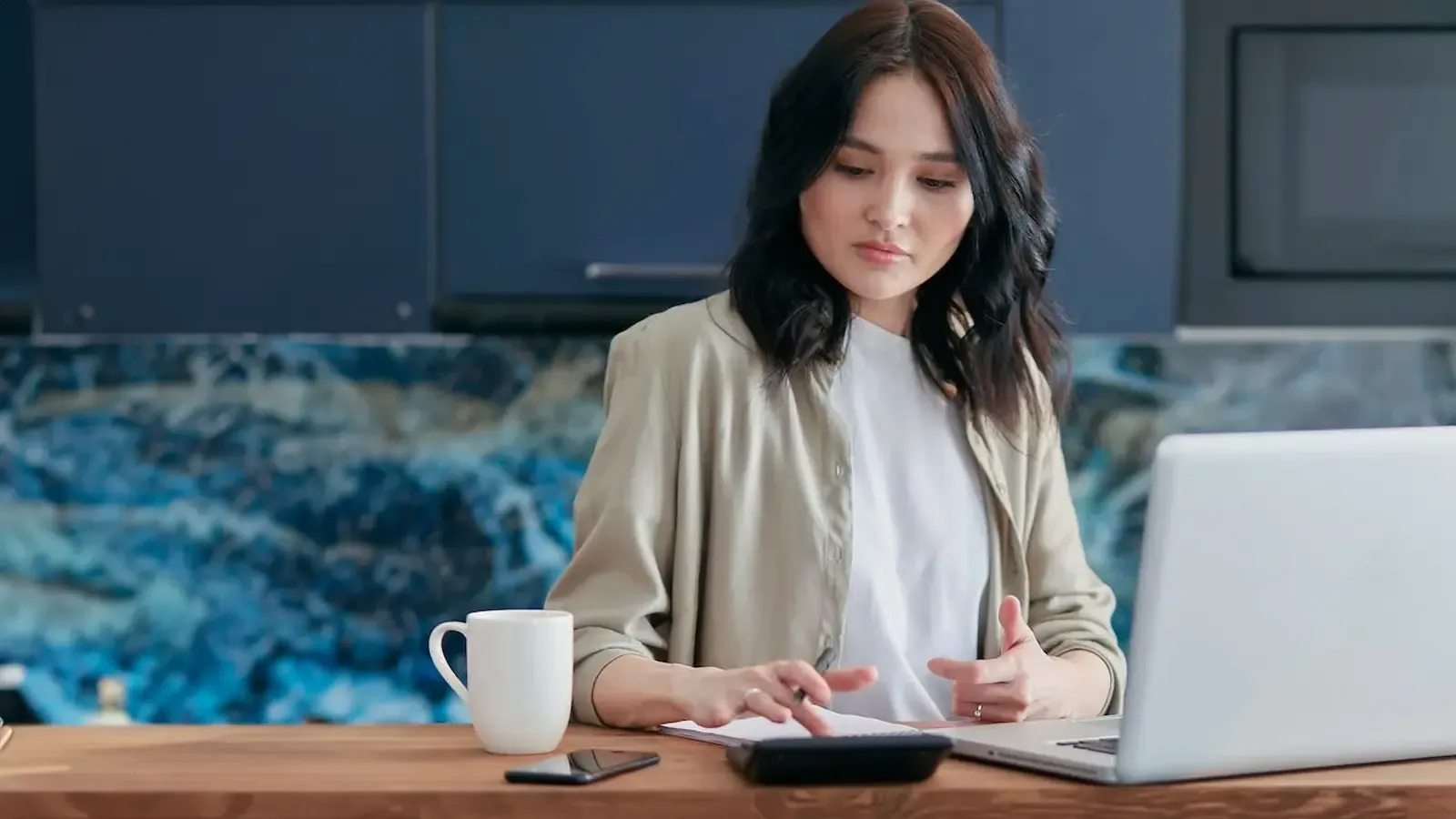 Woman calculating her payment