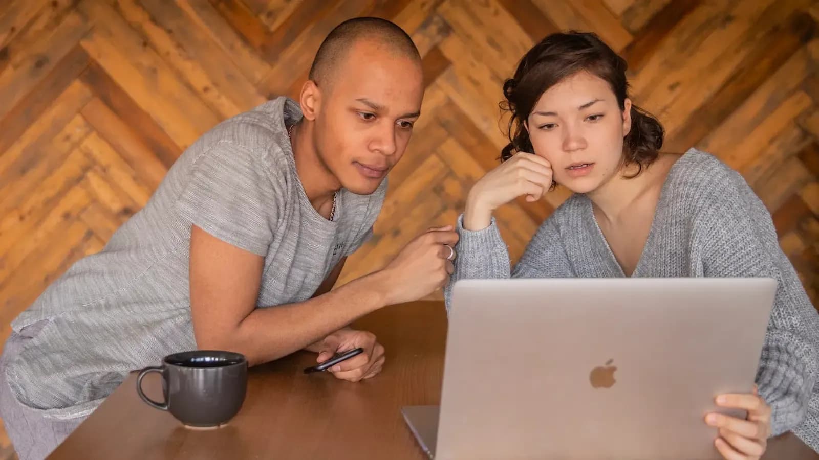 Couple looking over their computer