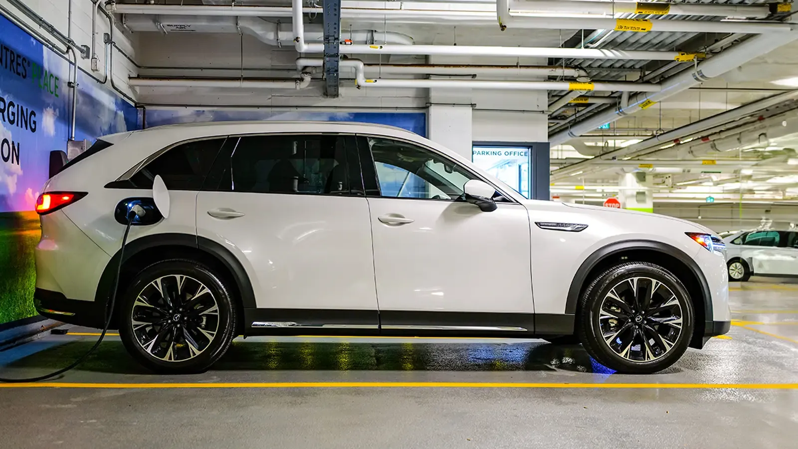 2024 Mazda CX-90 Plug-In Hybrid exterior charging in a garage