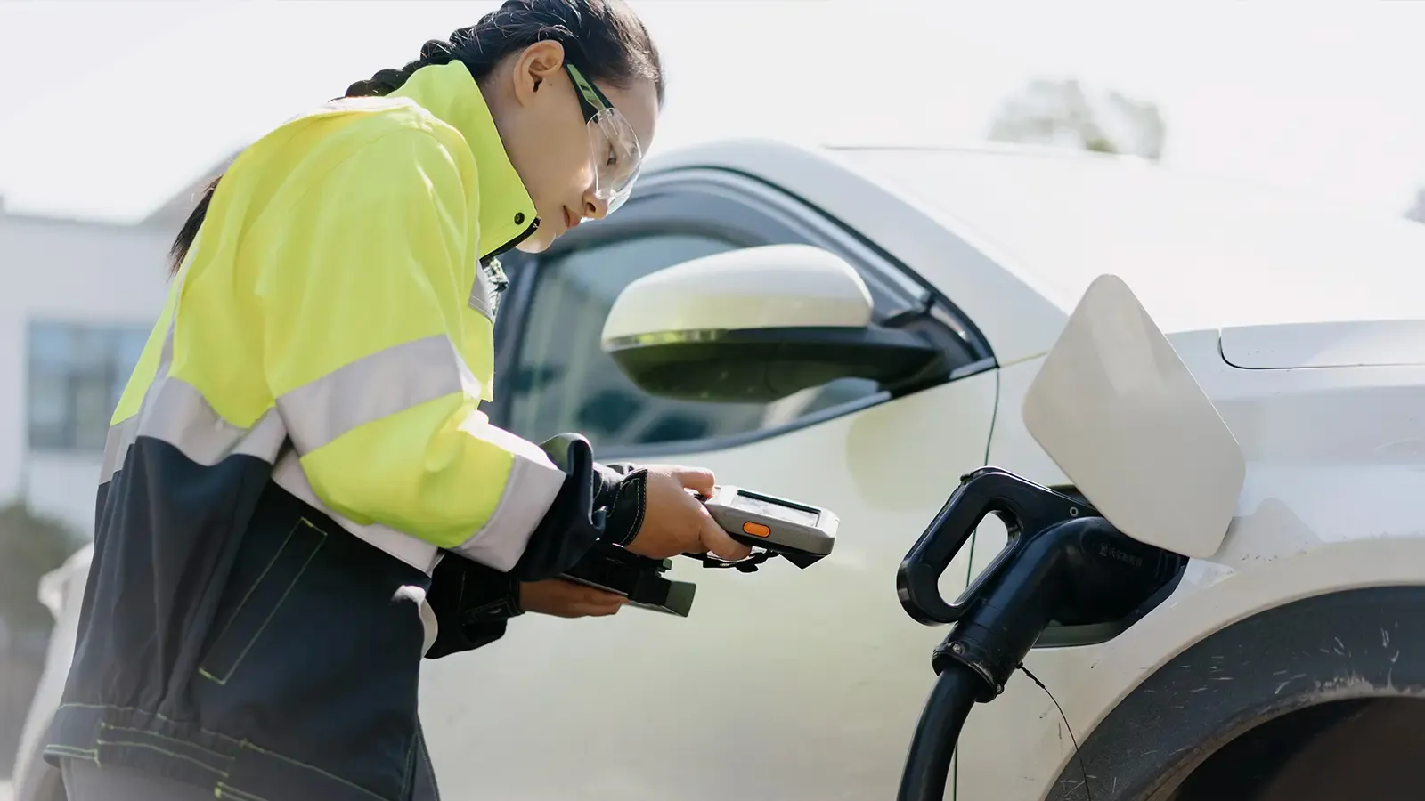 Technician analyzing an electric car