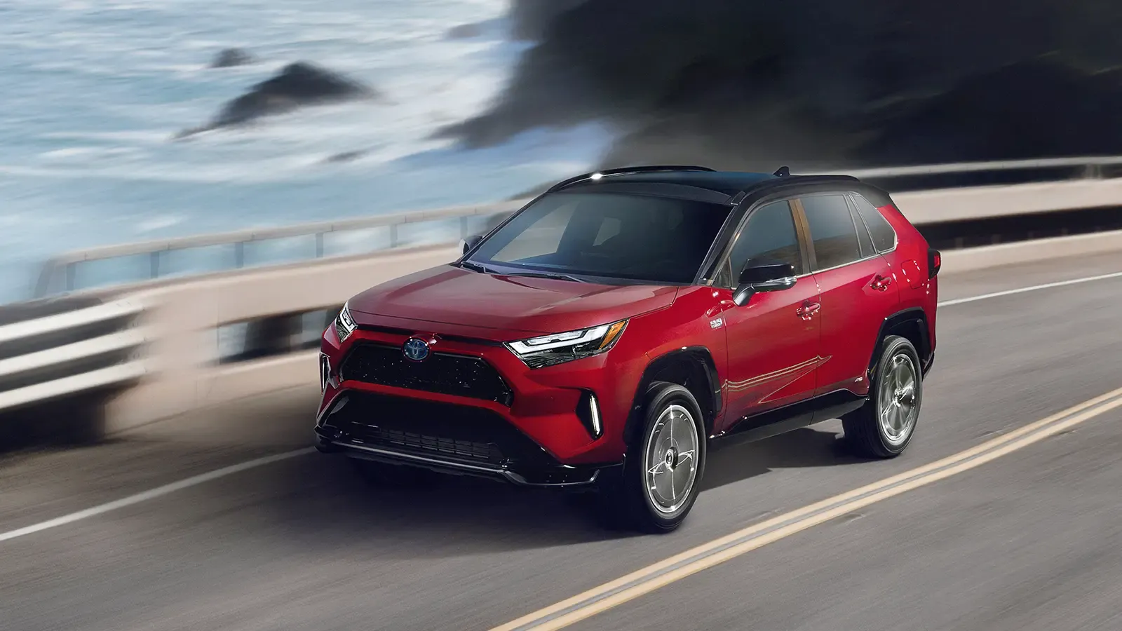 Toyota RAV4 Prime driving on a bridge over water