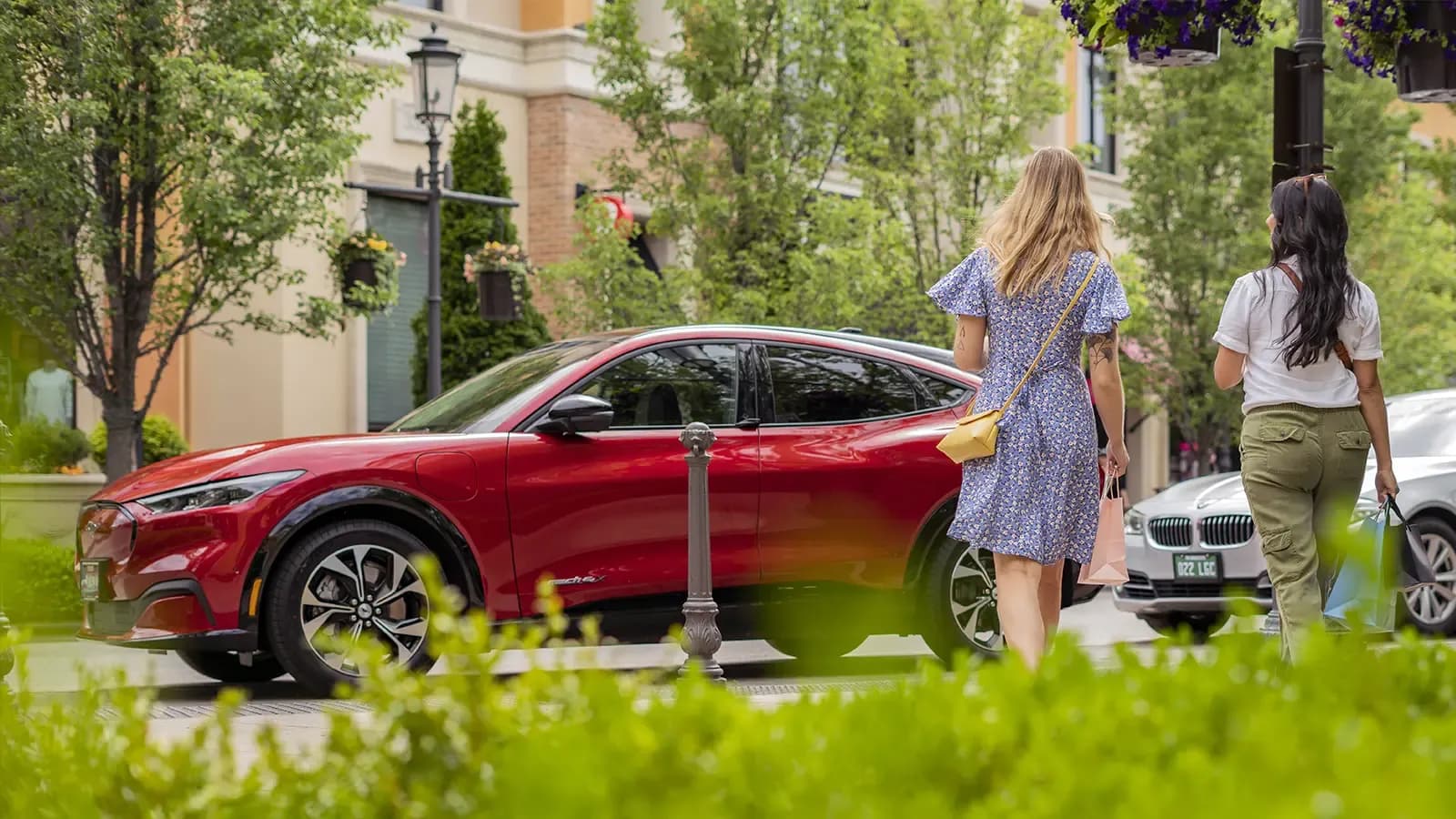 red EV parked in the woods